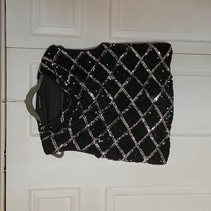 Black sequin top with silver detail. Never worn